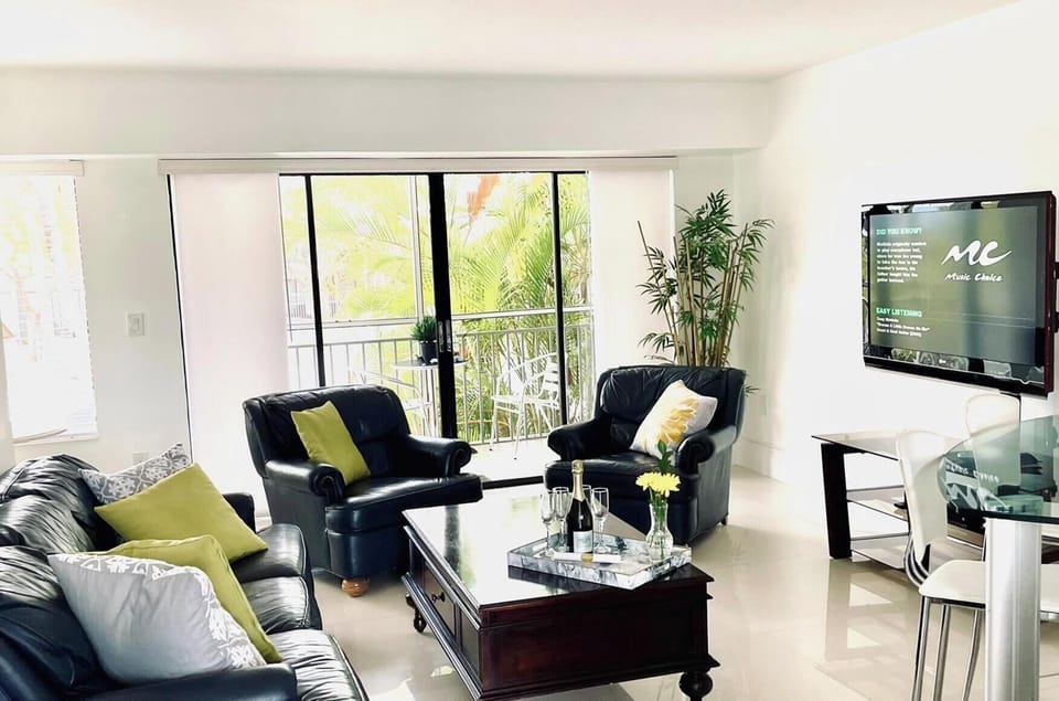 Living room. 2nd floor. View to lagoon and pool 