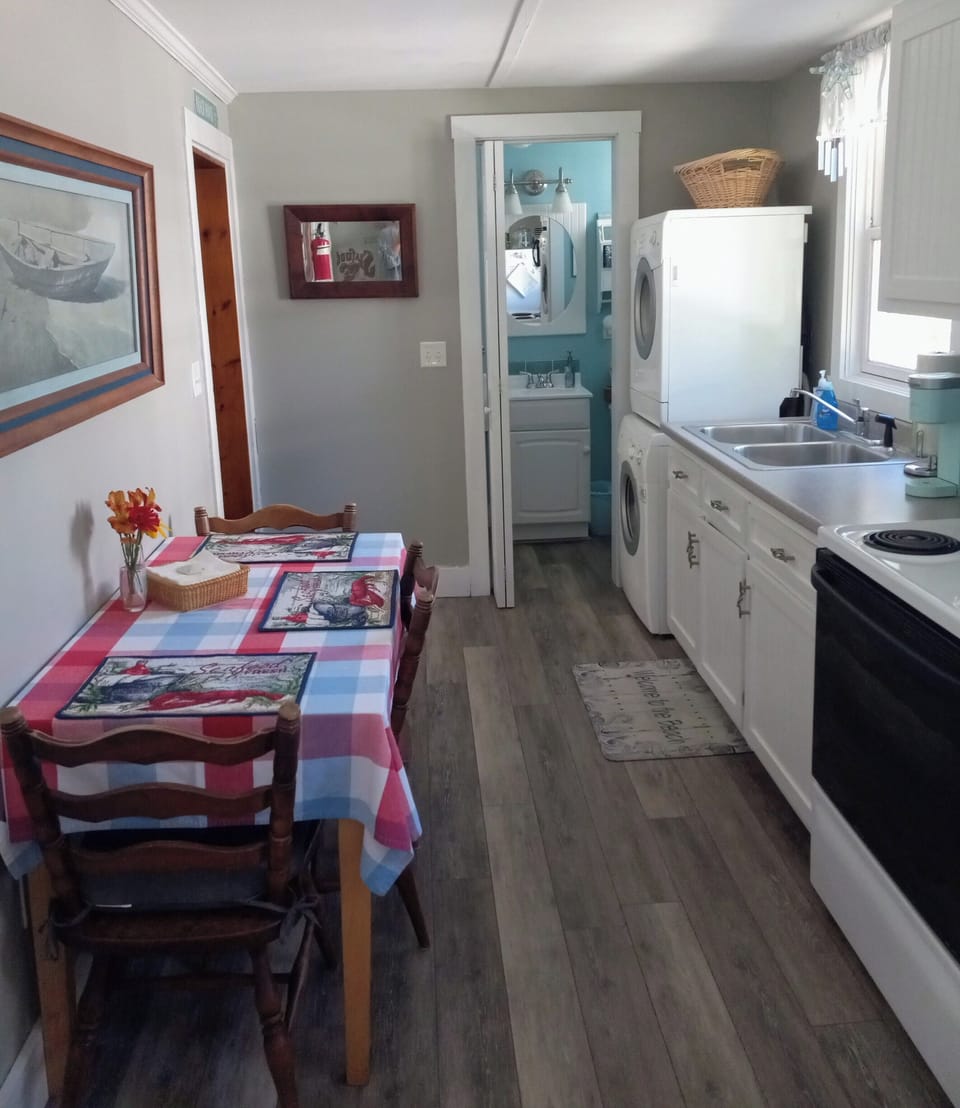 Fully equipped  eat in kitchen adjacent to downstairs 3/4 bath & washer dryer.