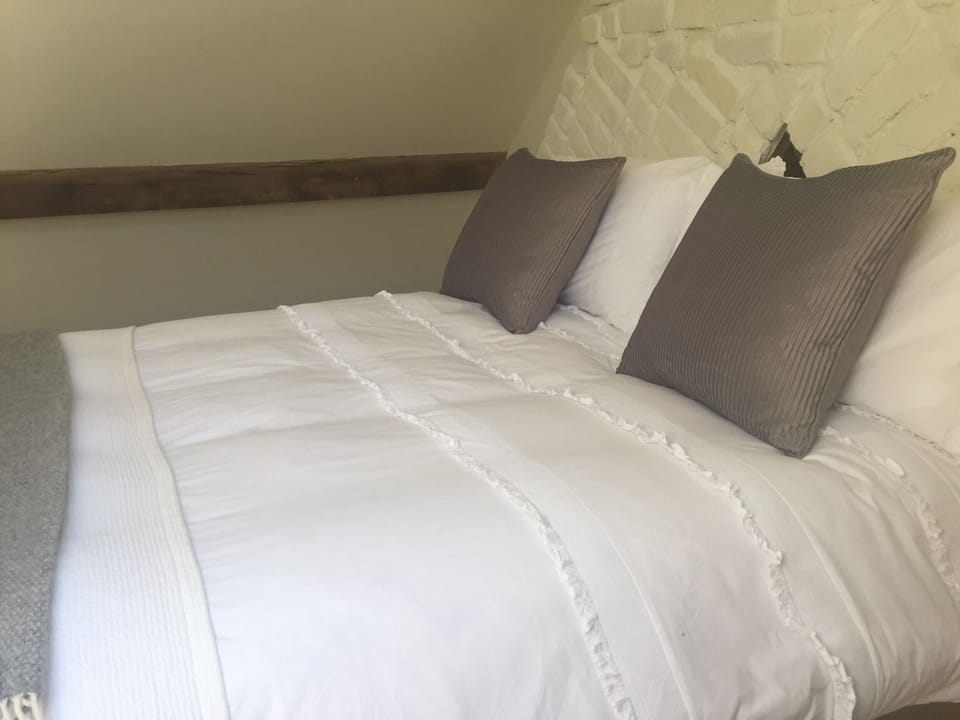 King size bed in attic bedroom
