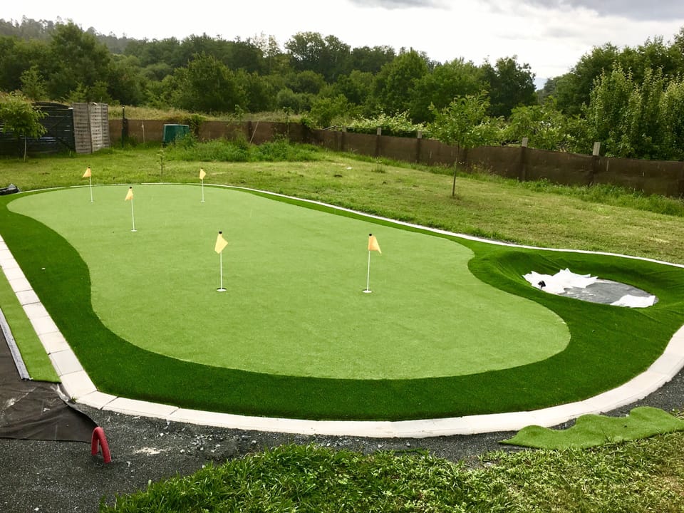 Large Putting green with artificial grass  and sand bunker