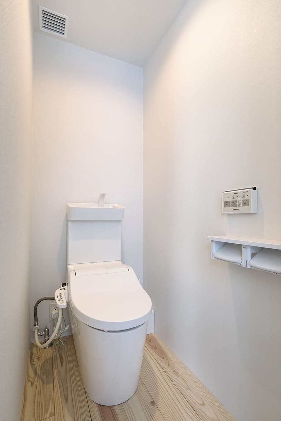 Shower, hair dryer, slippers, towels