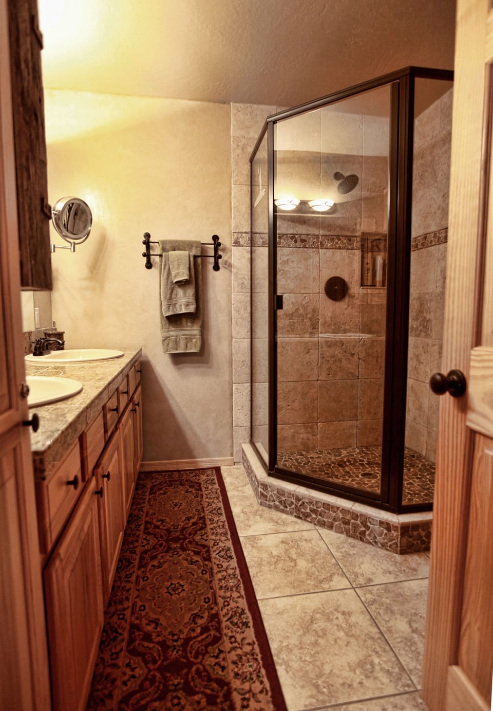 Master Bathroom with Dual Vanity, Walk-in Shower with River Rock bottom