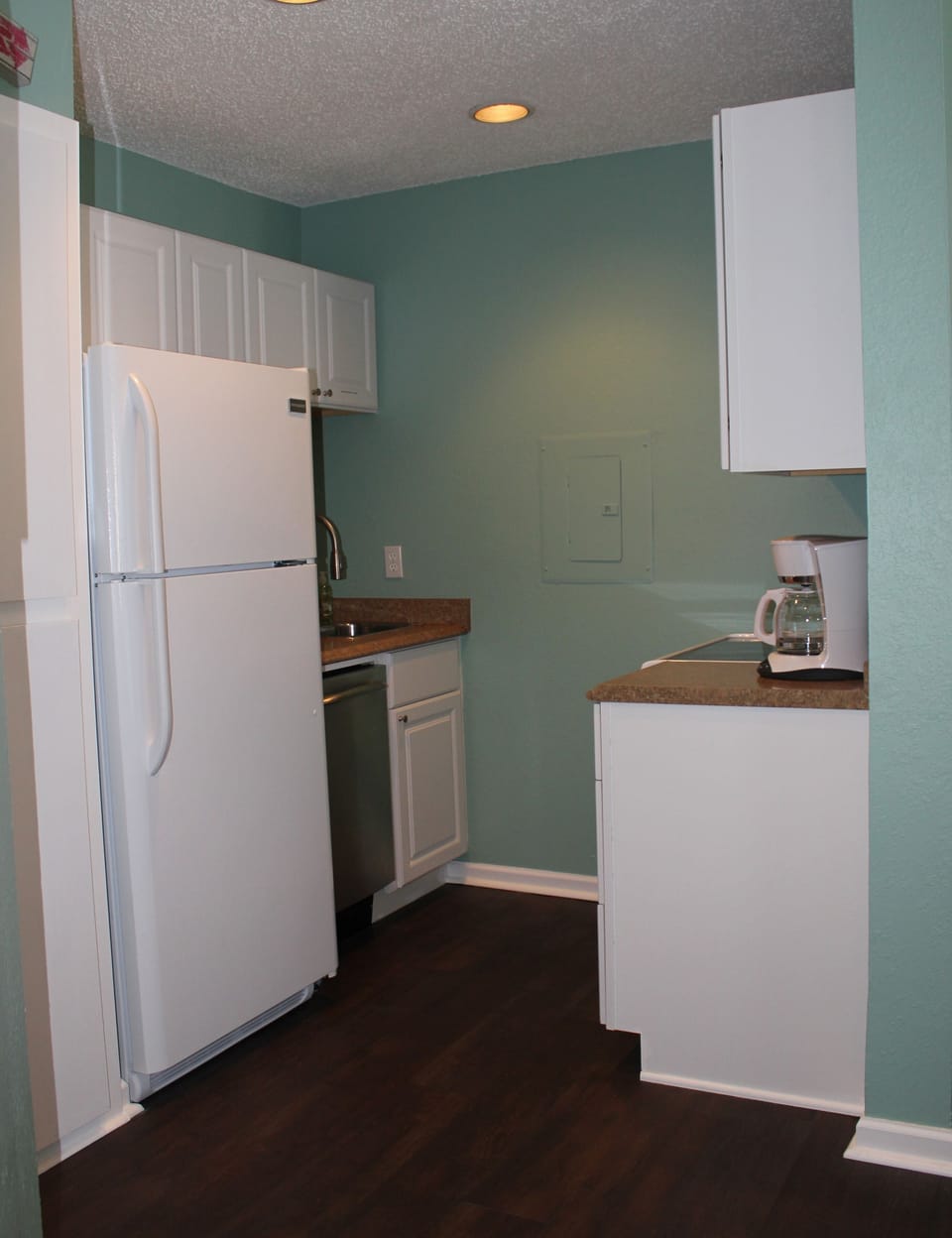 Kitchen stocked with cookware, dinnerware, etc.