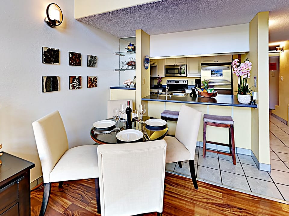 Dining Area - Enjoy serving your guests at the kitchen countertop with bar seating for two and dining room table seating for four