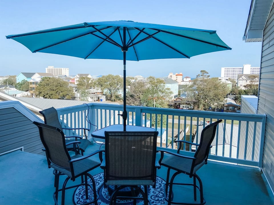 Enjoy the ocean breeze from 4th floor rooftop deck with peaking ocean views. 
