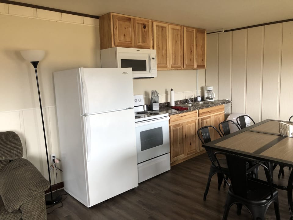 downstairs kitchen with table that seats 8.