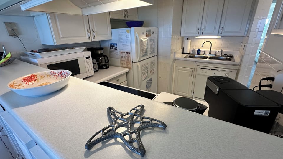 Enjoy the convenience of a pass-through kitchen that opens into the dining room.