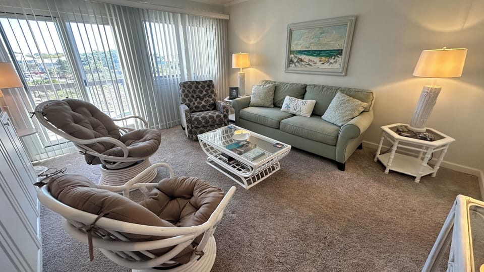 Unwind in style in our cozy living room—your perfect beachside retreat.