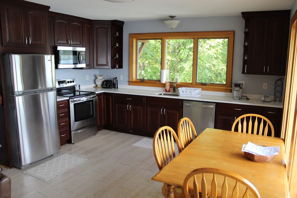 Beautiful cherry cabinets, stainless steel appliances and granite counter tops. 
