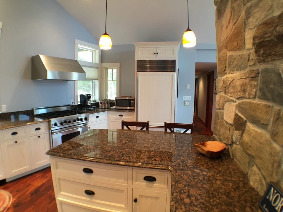 Large open kitchen with high end appliances and granite counter tops throughout