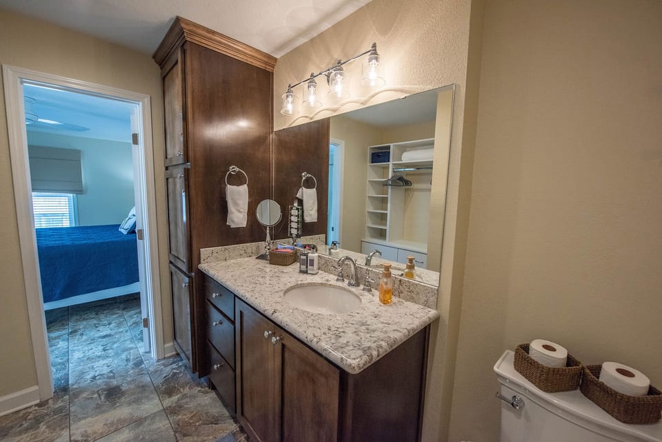 King  ensuite vanity area designed to provide a large area for personal items.