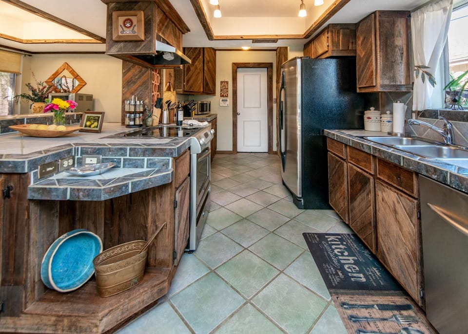 Large Kitchen with reclaimed wood, stainless steel appliances