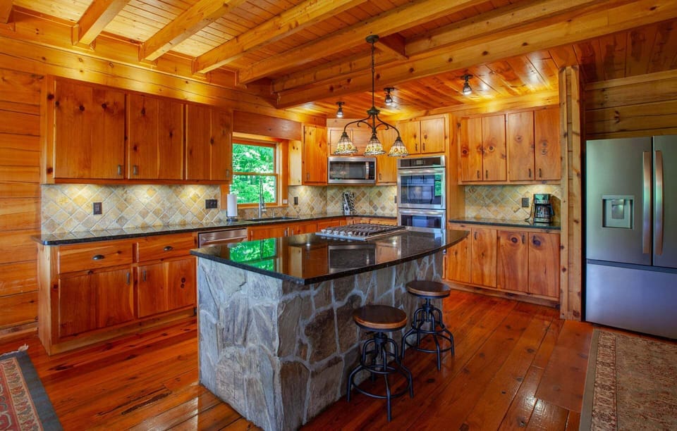 Fully-Stocked Kitchen with Granite Countertops and Stainless Steel Appliances