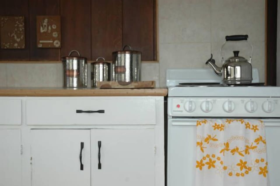 Close up- kitchen counter top and Le Creuset teapot