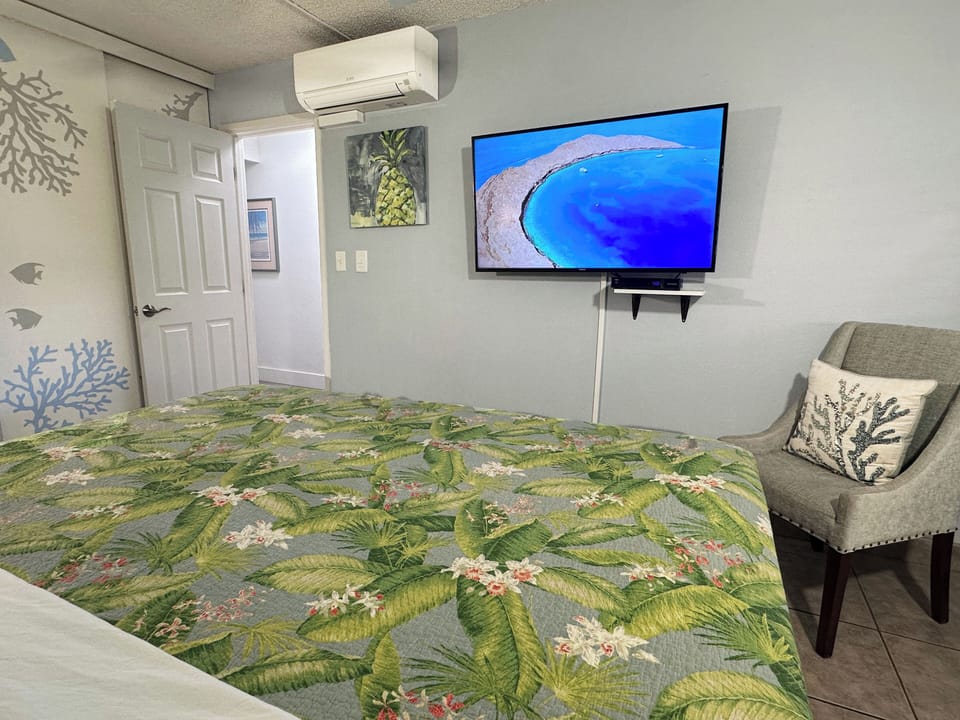 Tropical touches and soft tones make this bedroom a peaceful retreat.