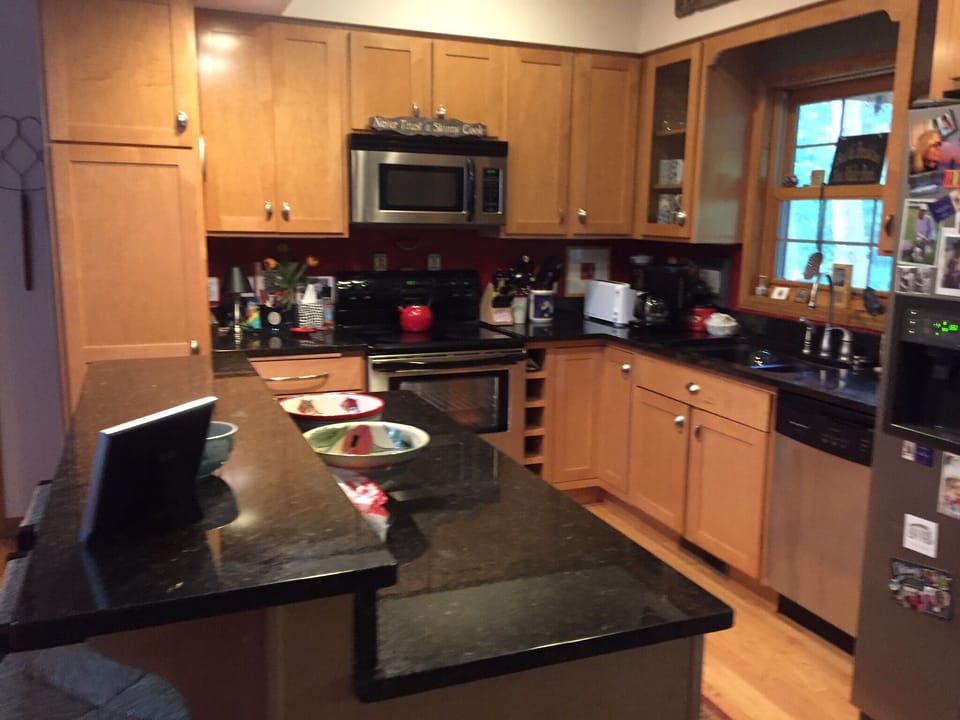 Kitchen, island with three barstools
