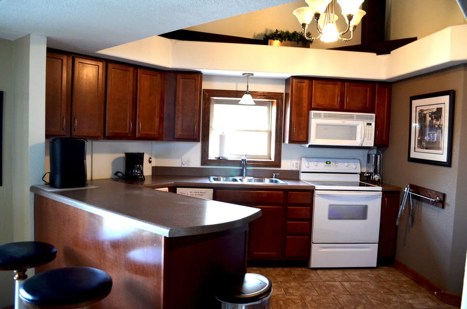 Open kitchen with bar seating