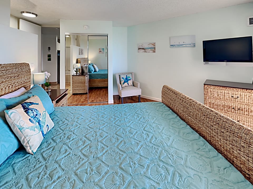Snuggle down and watch your favorite movie on your bedroom flat screen TV.