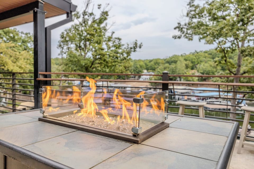Cozy fire pit with scenic water views, perfect for a serene retreat