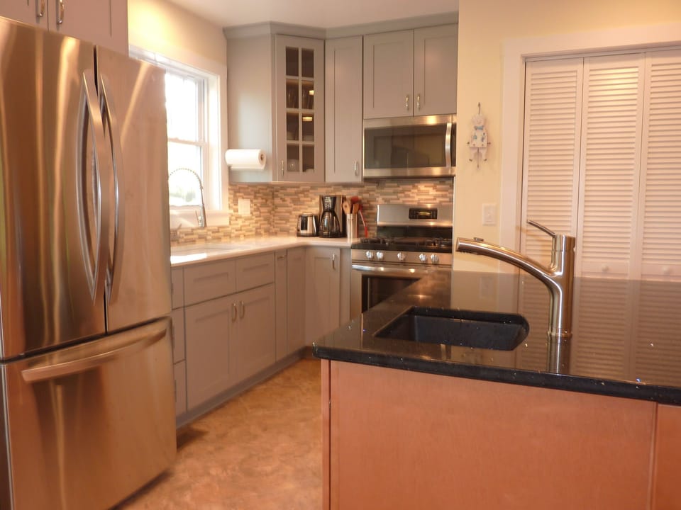 Dual sinks, quiet appliances, quartz counters, convection range, laundry closet.