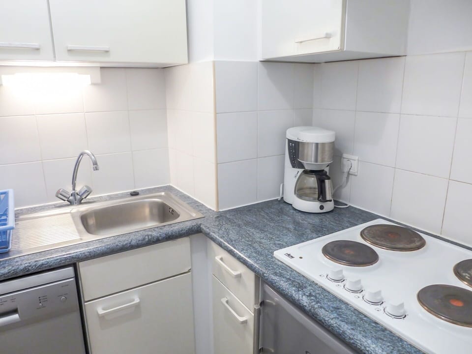 Countertop, Property, Room, Kitchen, Tile, Sink, Cabinetry, Furniture, Interior Design, Kitchen Sink