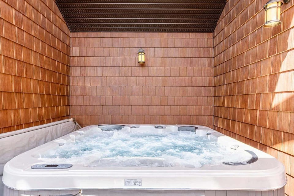 Enjoy the gorgeous 6 person private rooftop hot tub - all to yourselves! Also on the hot tub deck is a spacious area with lounge furniture and incredible mountain views.