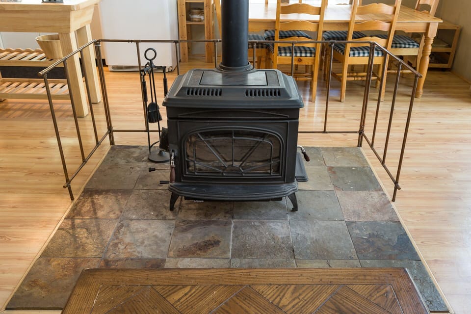 Wood Stove warms up both the kitchen and living room