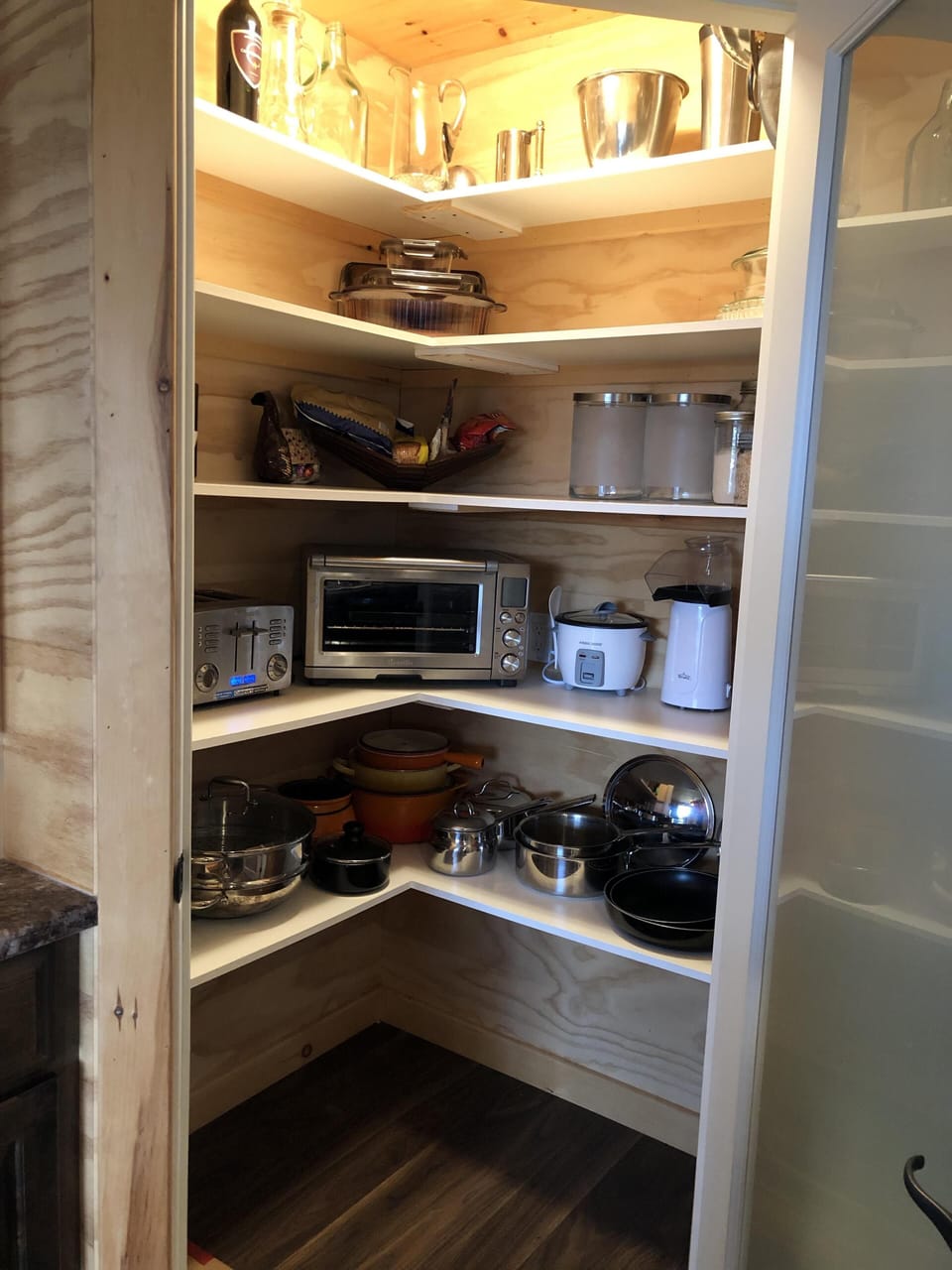Full pantry with appliances and cookware.