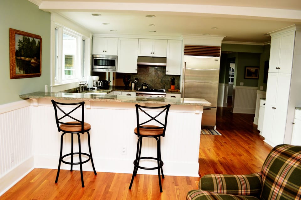 New kitchen with Sub Zero refrig, Wolf gas range, Bosch d/w and granite counters