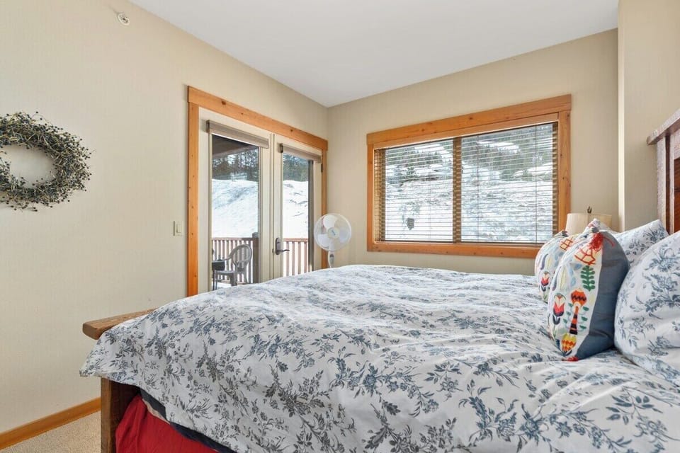 Primary Bedroom with King Bed, Full Bath, Balcony Access and Slope Views