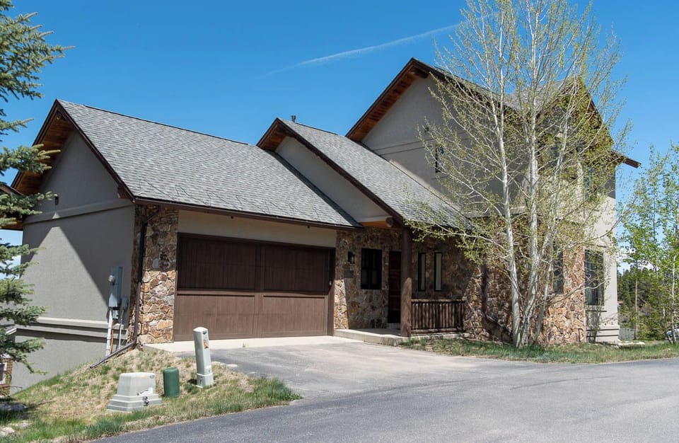 Two car garage with space for two more vehicles on the driveway
