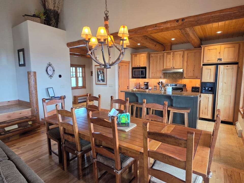 Kitchen with an island & dining table.