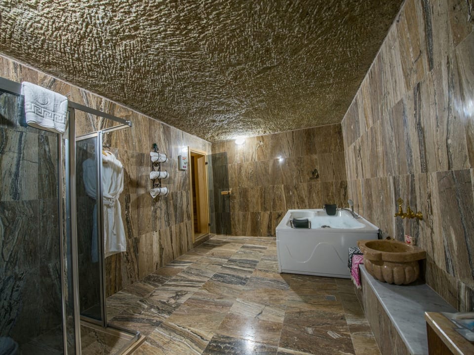 Family Suite, Multiple Beds, Non Smoking, Garden View | Bathroom | Shower, free toiletries, hair dryer, slippers