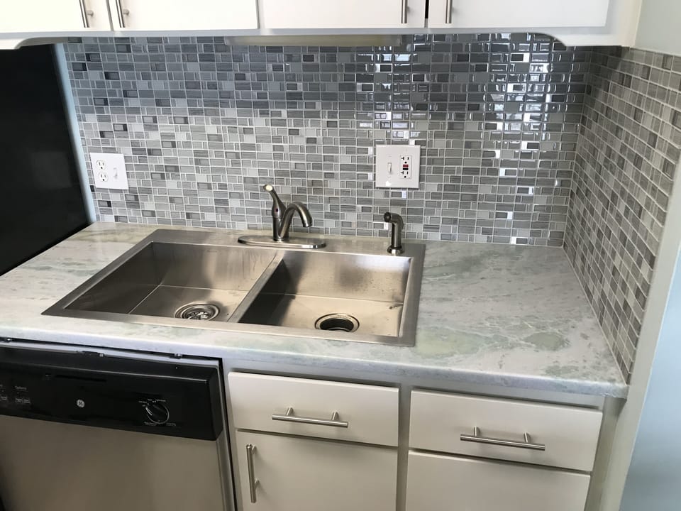 Remodeled kitchen with new stainless appliances and quartzite countertops!