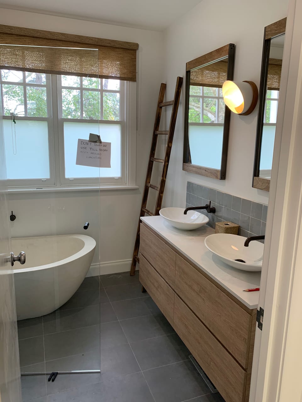 Main Bathroom with stone bath and shower.  Toilet is separate next to bathroom.