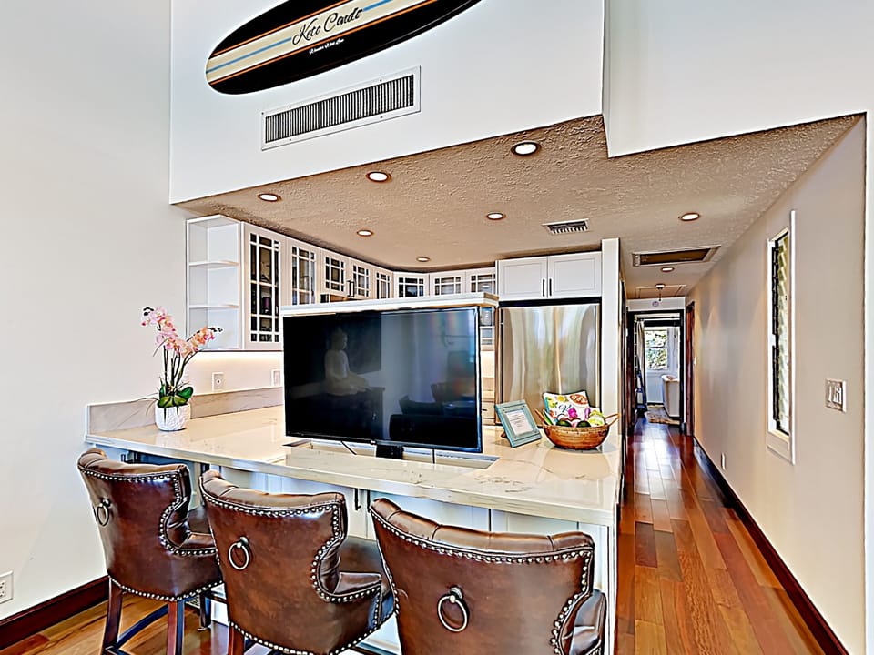 Kitchen - Custom features include a flat screen TV that can be hidden in the kitchen counter top!
