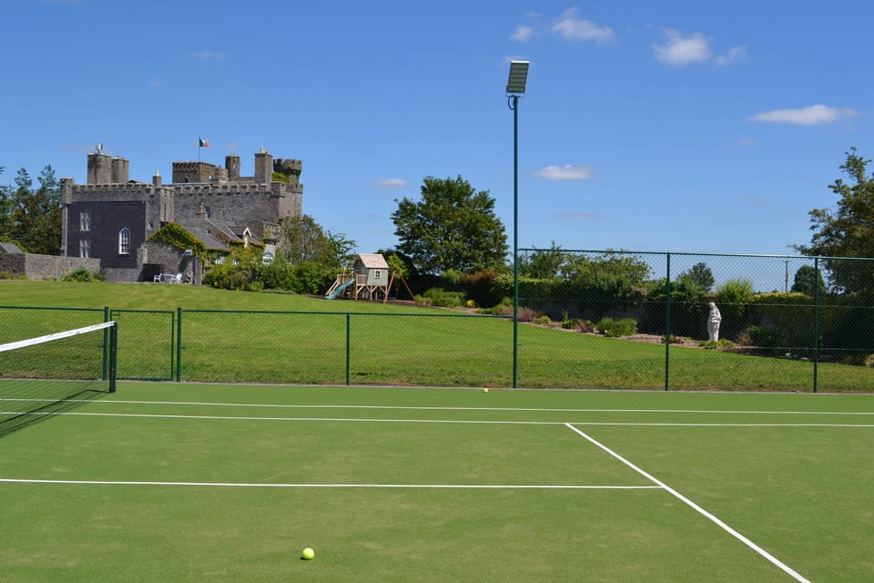 Flood lit private tennis court  