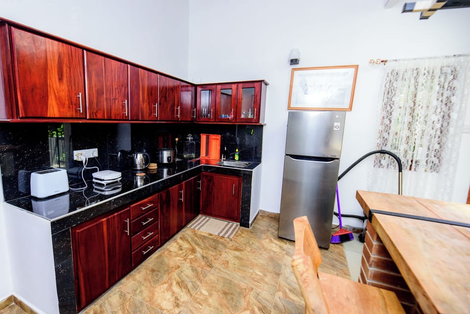 Deluxe Comfort, 2 Bedroom | Private kitchen | Coffee/tea maker, electric kettle, toaster, rice cooker