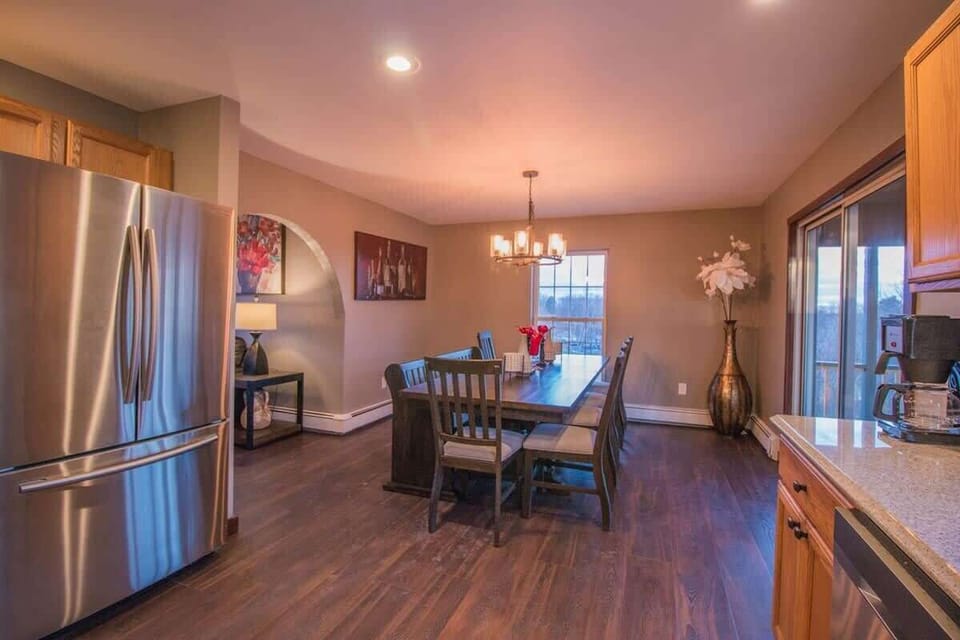 Brand new stainless steel appliances and granite counter-tops. Dining for eight.
