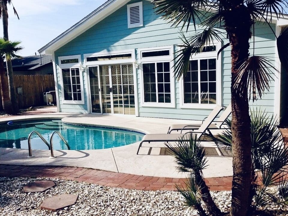 Escape to our backyard oasis to unwind and a take a dip in the pool.