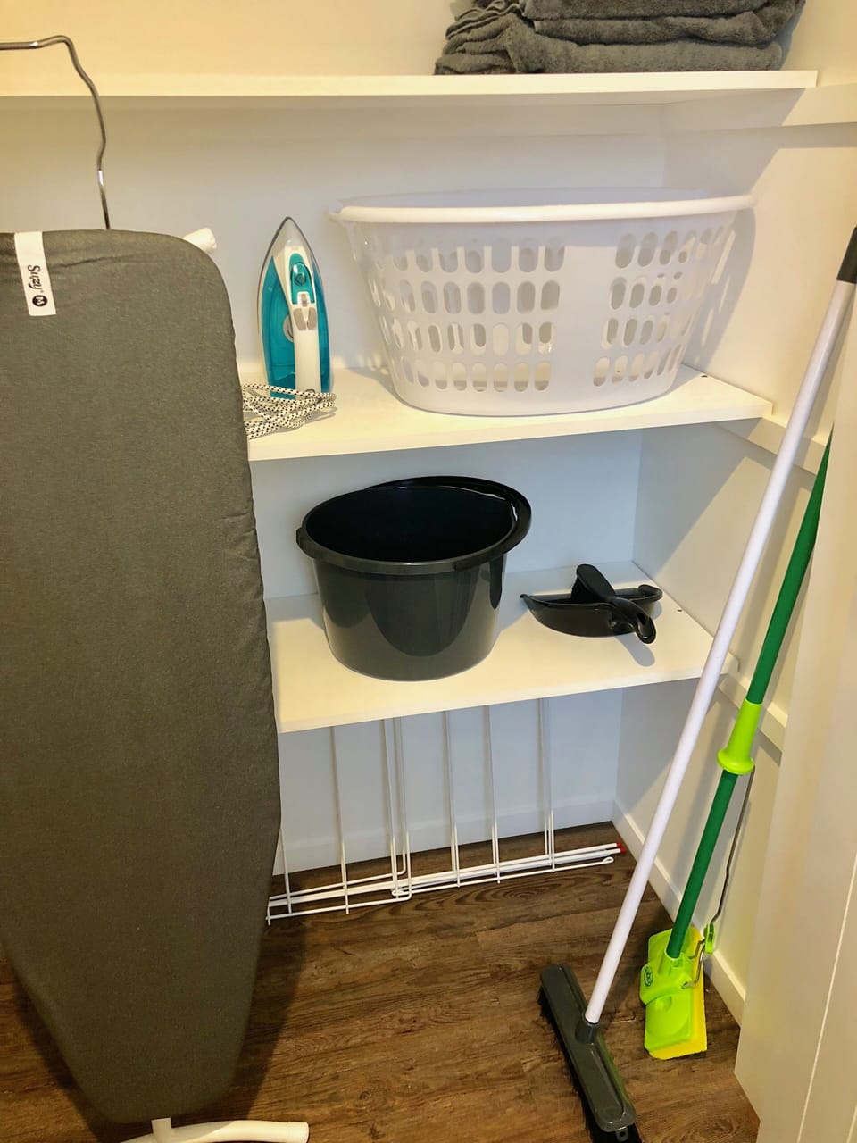 Iron and Ironing Board, A Frame clothes dryer, There is a washing line outside.