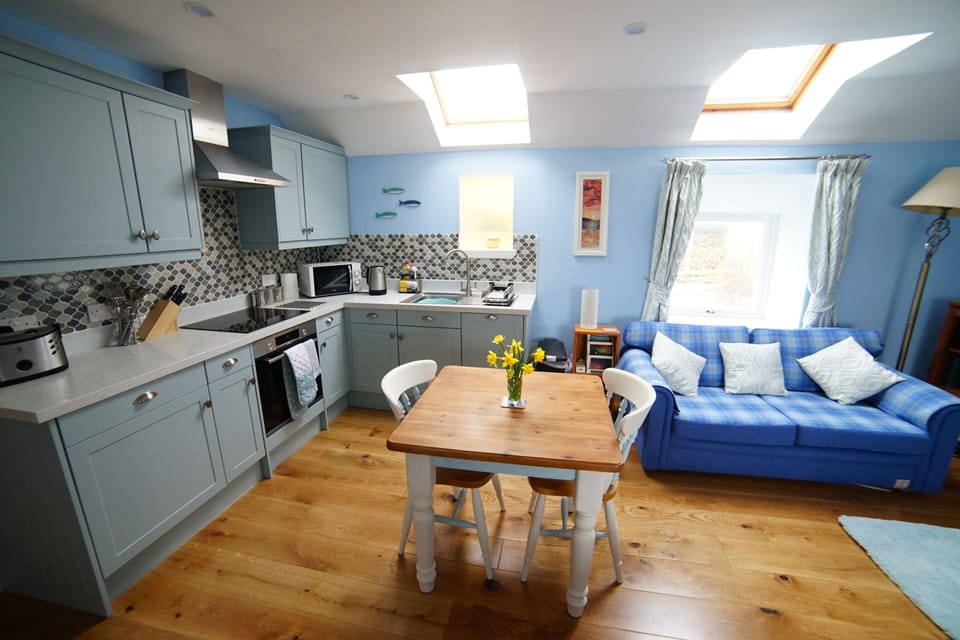 There are comfortable seating, eating and food prep areas in the living room.