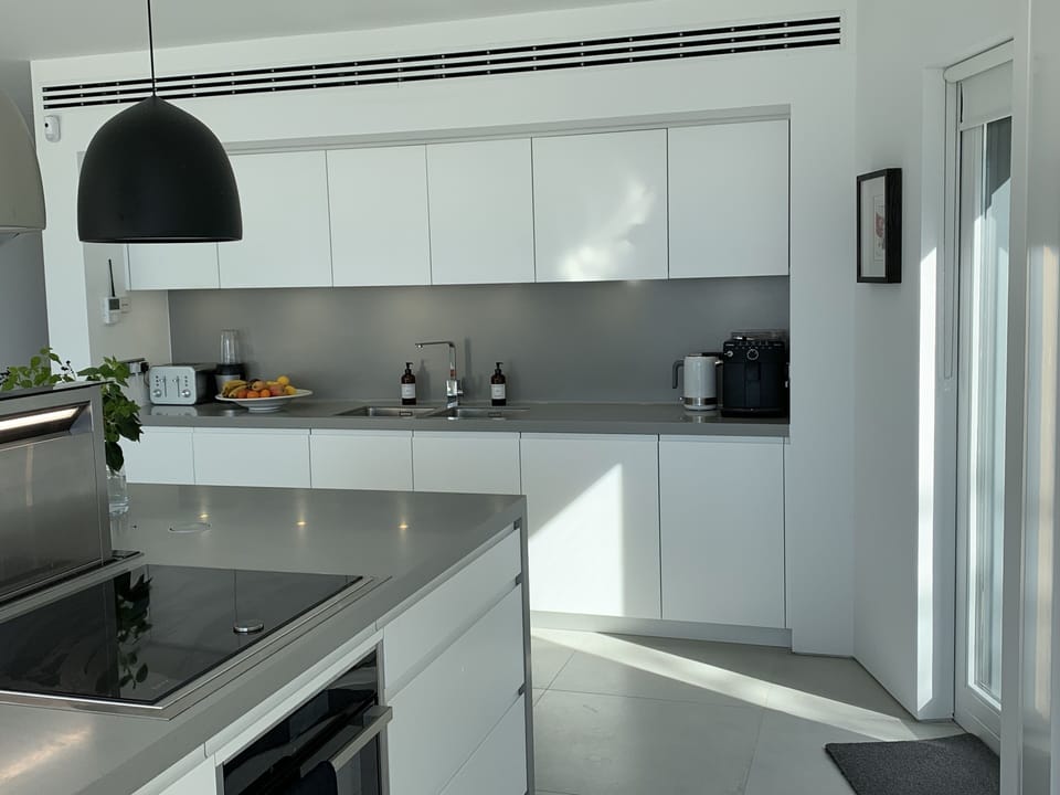 Double sink,Dishwasher underneath,Neff and hobb and concealed retracting fan