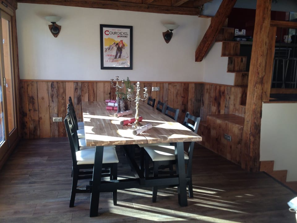 Dining area showing steps to kitchen area