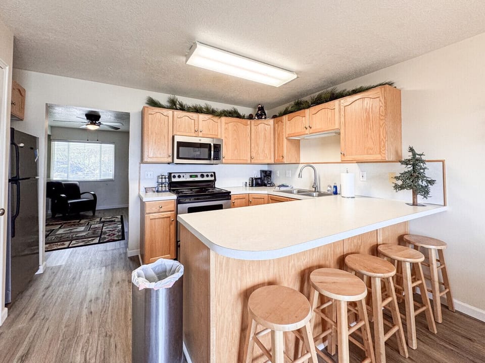 Spacious kitchen with bar seating, ideal for casual dining