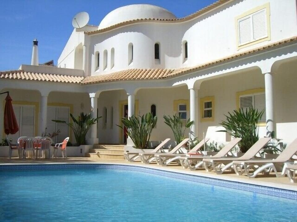 Sunbathing facilities by the pool of  Villa Douro