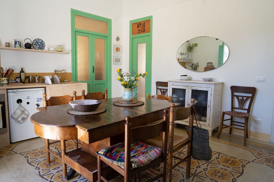 Dining room and kitchen, access to bedroom 1 and bathroom 1 in the background