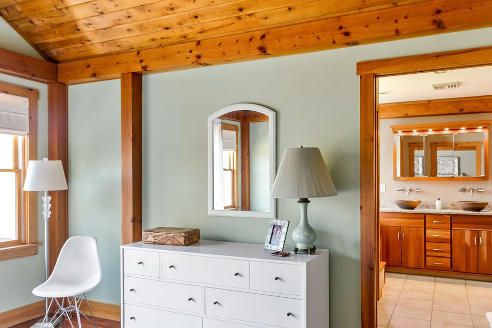 Master bedroom leading to bathroom with double sink, double shower and jacuzzi.