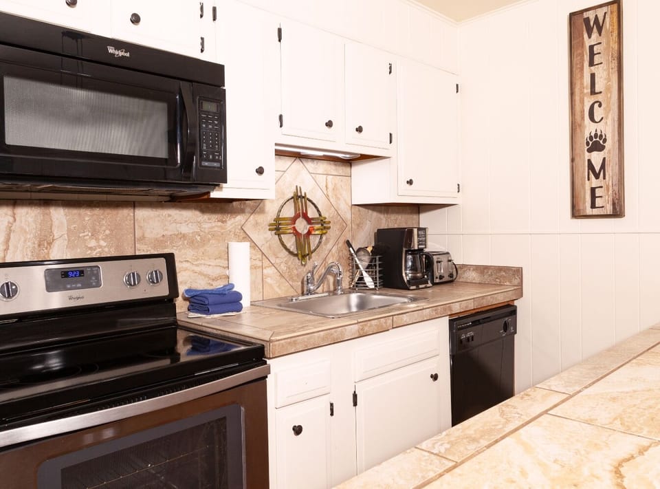 Your fully-equipped kitchen awaits with modern appliances, ample counter space, and everything you need to prepare your favorite meals during your stay.