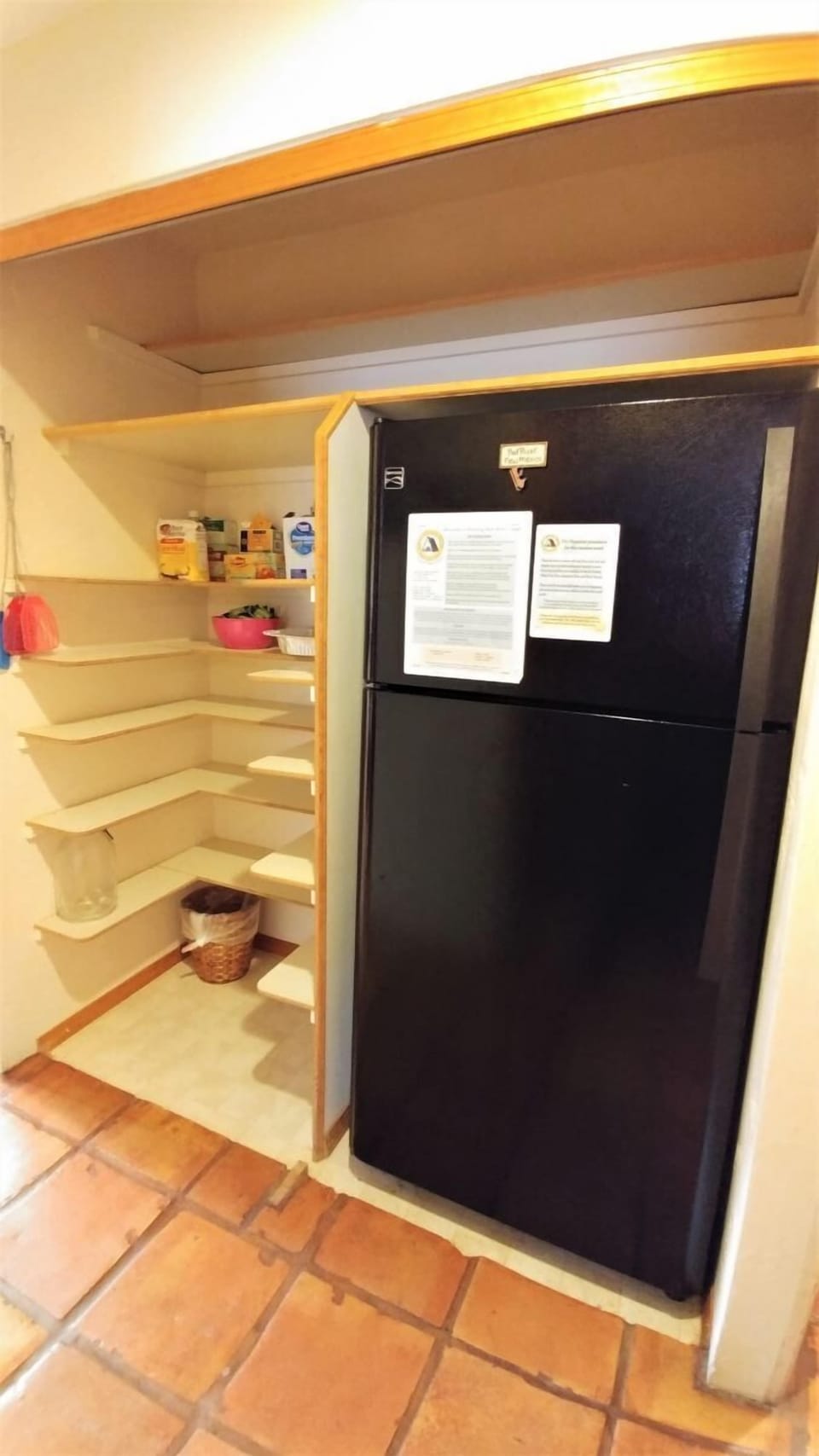 A well-stocked pantry with open shelving and a full-size refrigerator ensures you have all the space you need to store your favorite meals and snacks during your stay.